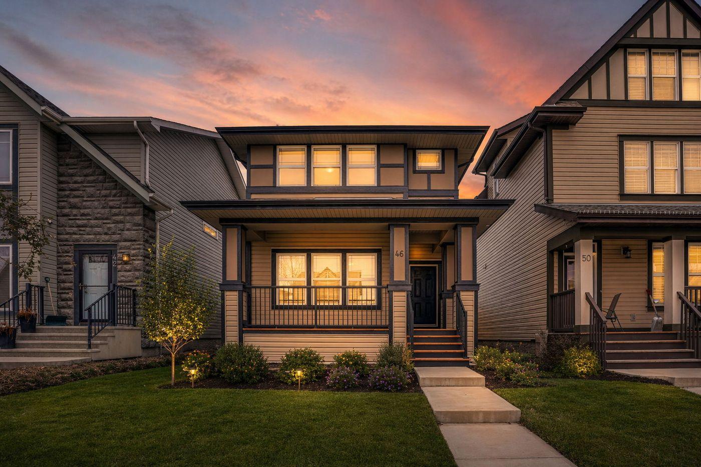 Two-storey laned home with a covered front porch at sunset in Walden